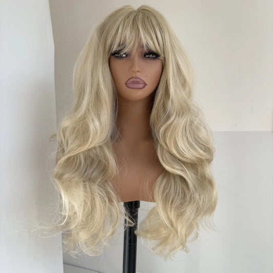 Long wow hair and bangs of long wavy gray blonde hair